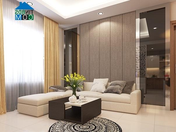 Bộ sofa khá đơn giản và bàn trà bằng gỗ có thiết kế độc đáo